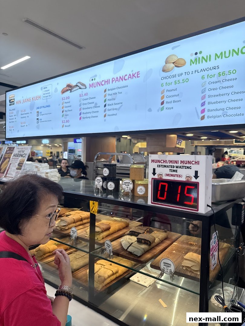 A woman looks at a display of pancakes at Munchi Pancakes NEX.