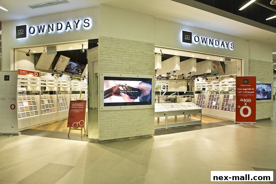 The exterior of an OWNDAYS eyewear shop with displays of glasses and promotional banners.