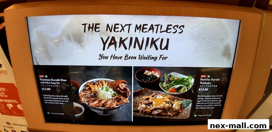 A digital menu board showcasing two meatless Yakiniku dishes from Aburi-EN Nex.