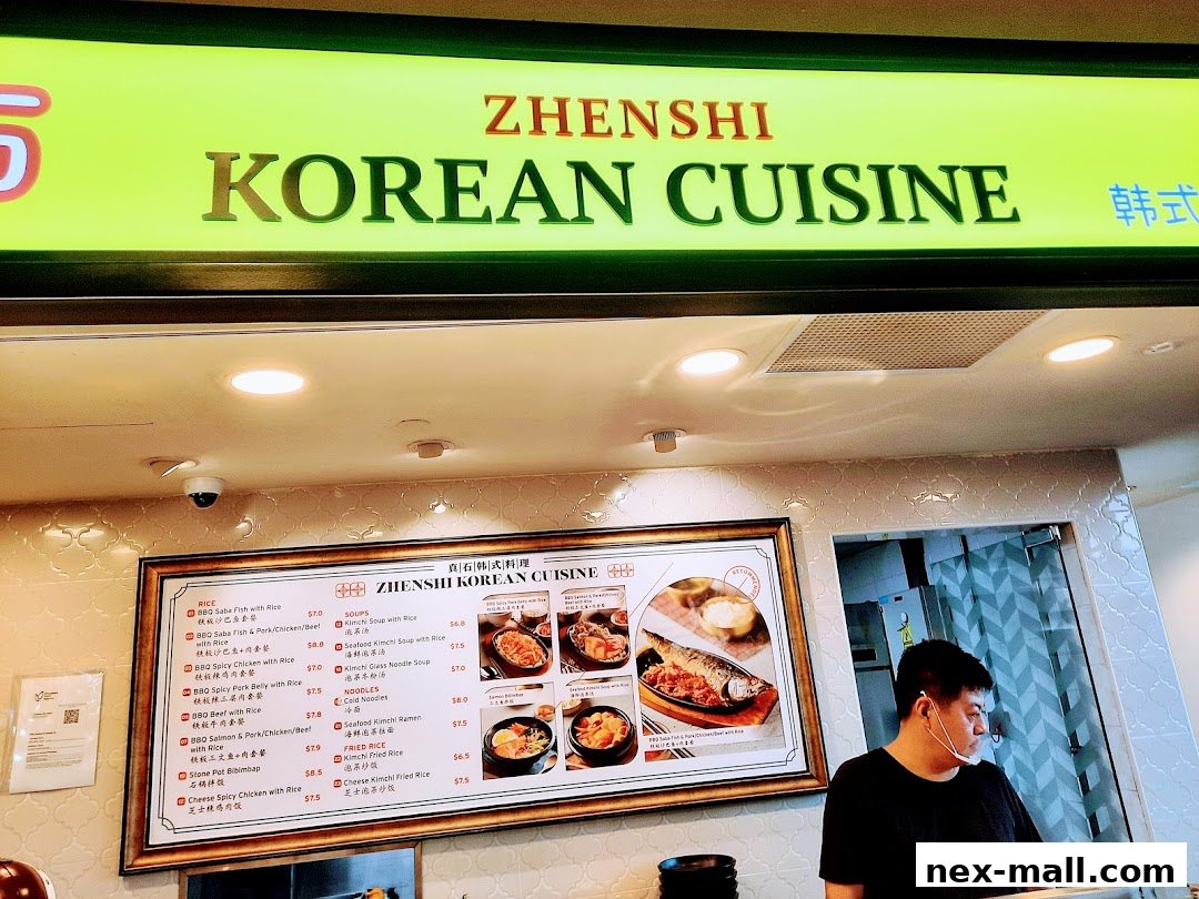 A menu board for Zhenshi Korean Cuisine featuring various rice dishes, soups, noodles, and fried rice options.