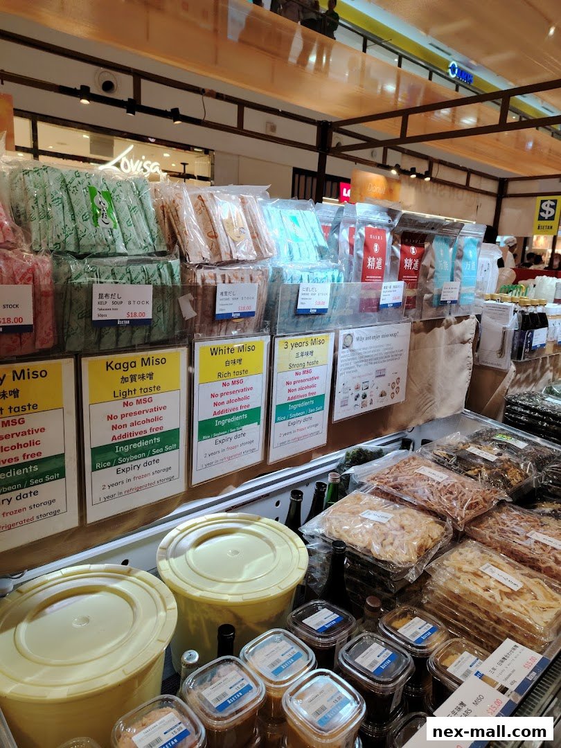A display of various Japanese food products, including miso and soup stocks, at Isetan.
