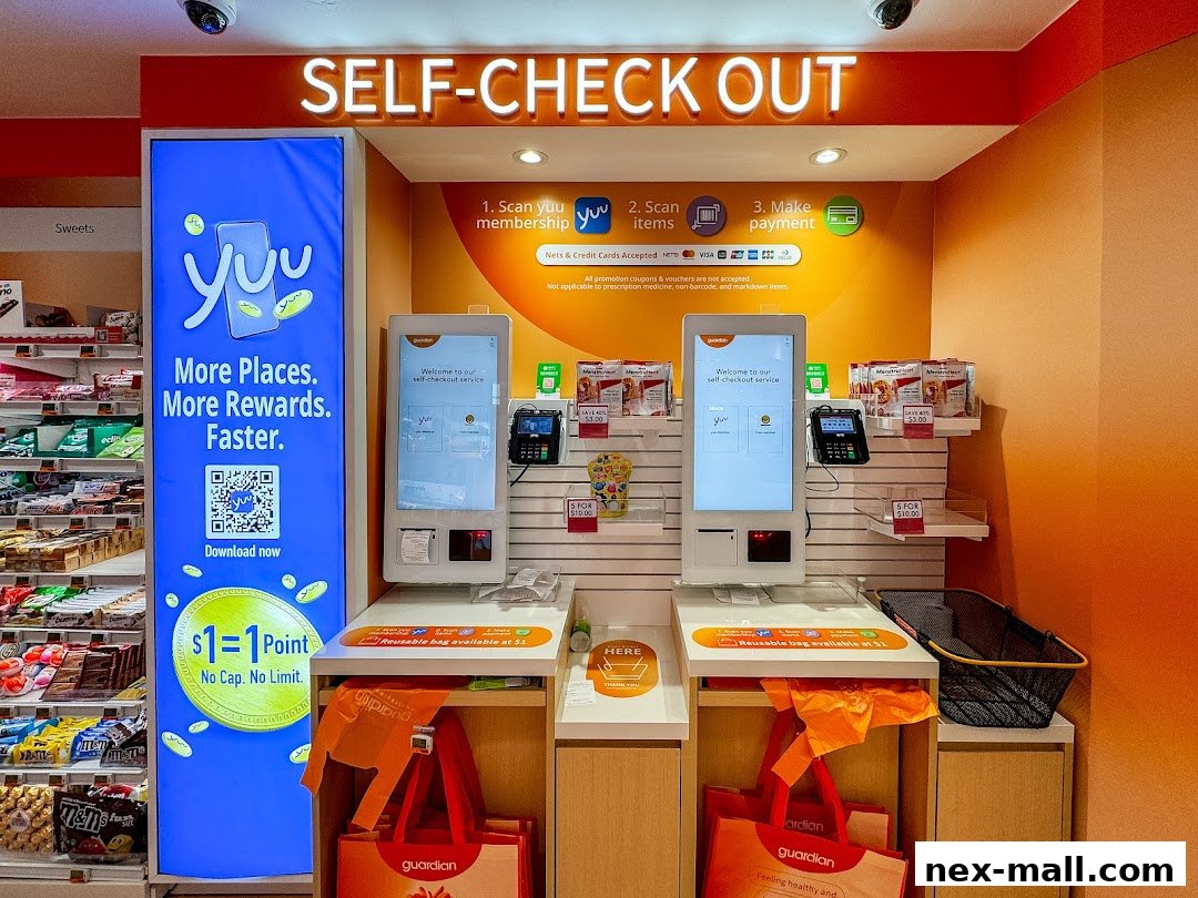 Self-checkout stations with digital displays and payment terminals at Guardian pharmacy.