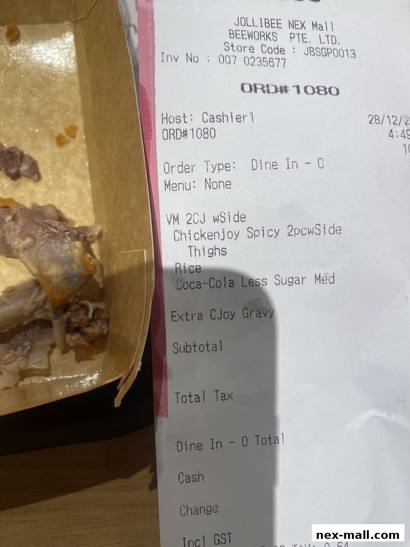 A receipt from Jollibee NEX Mall showing a Chickenjoy meal and a drink.