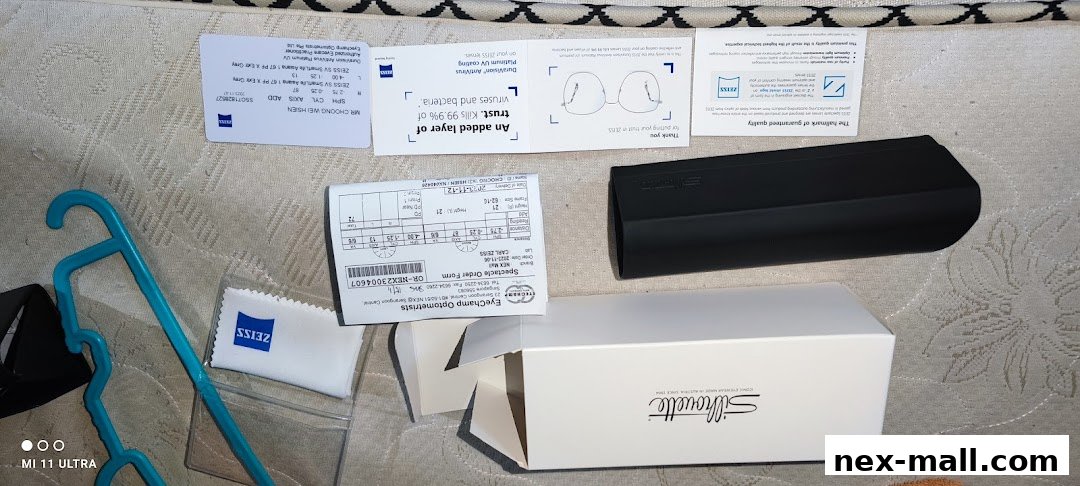 Eyeglasses, lens cleaning cloth, and order forms from EyeChamp Optometrists.