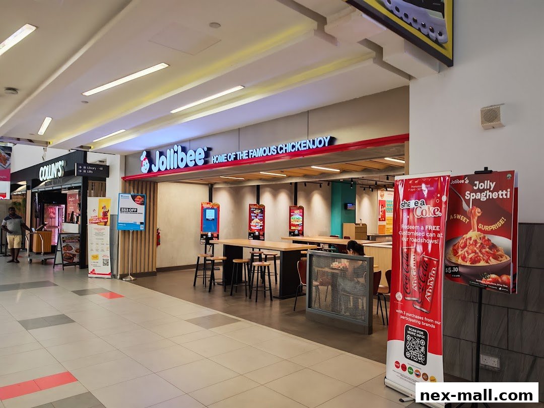 The Jollibee store entrance with promotional banners for Coke and Jolly Spaghetti.