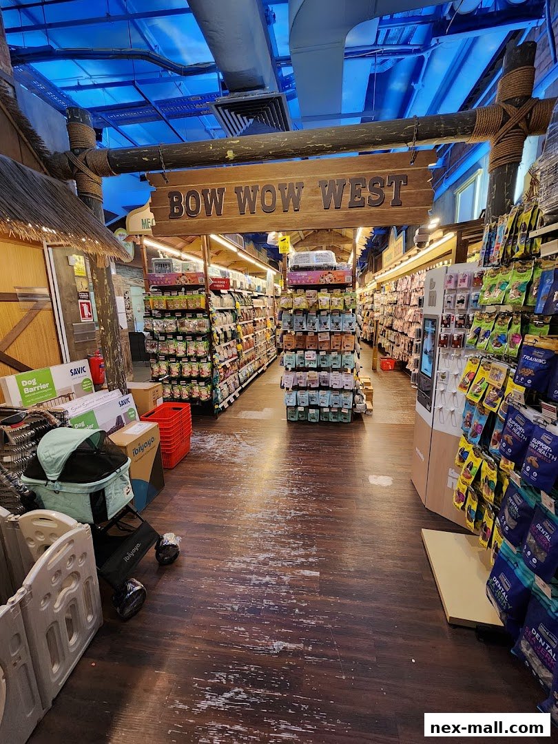 Interior view of a pet supply store with aisles of pet food and accessories.
