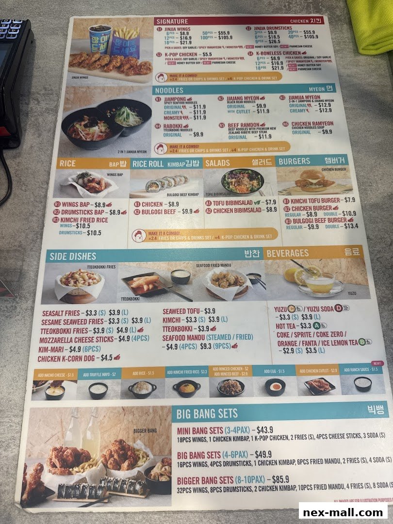 A menu from JINJJA Chicken NEX featuring signature wings, noodles, rice, salads, burgers, side dishes, beverages, and set meals.
