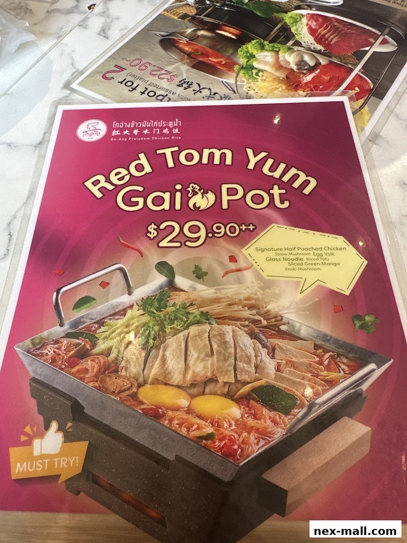 A menu featuring the Red Tom Yum Gai Pot from Go-Ang Pratunam Chicken Rice.