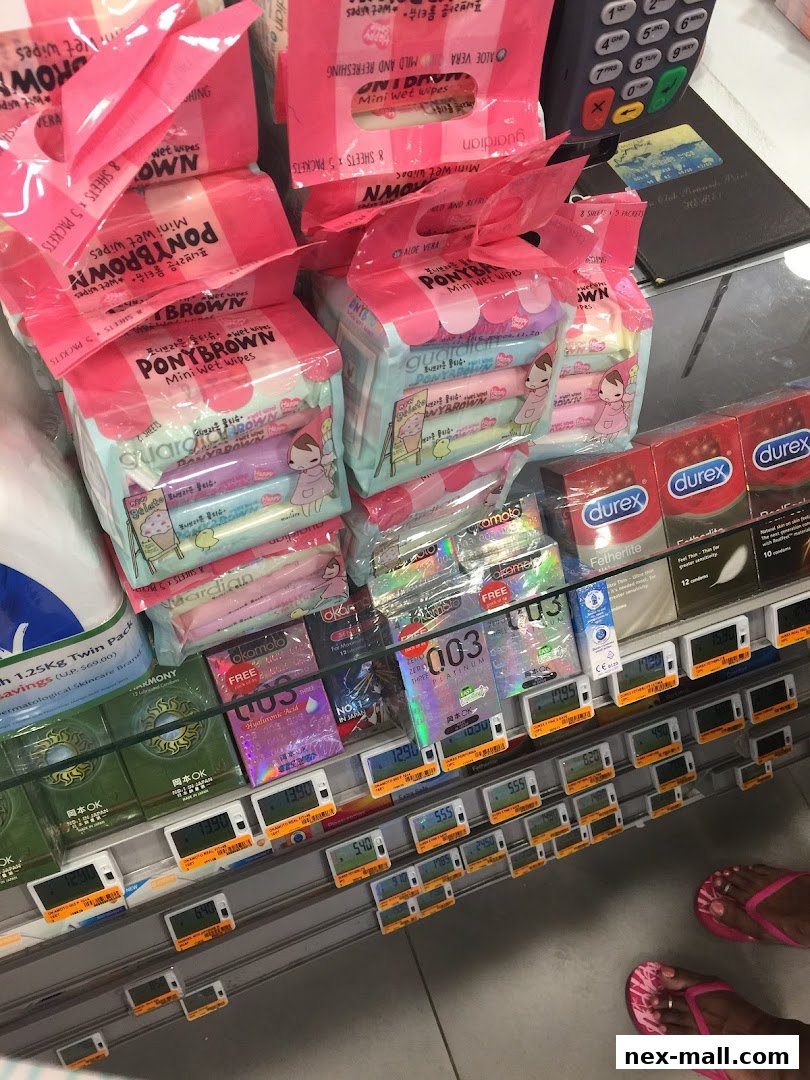 A display of wet wipes and condoms with price tags in a retail store.