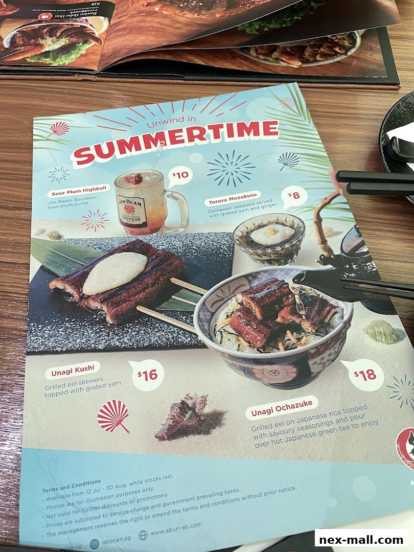 A menu featuring Unagi Kushi, Unagi Ochazuke, Sour Plum Highball, and Tororo Mozukusu.