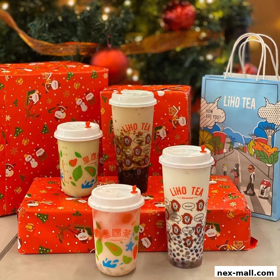 LiHO TEA drinks displayed with festive Christmas gift boxes and a shopping bag.