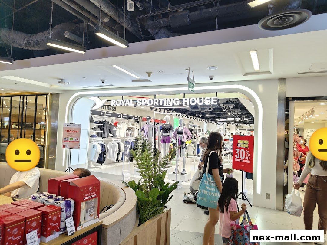 The entrance of Royal Sporting House, showcasing athletic apparel and a limited-time 30% off sale.