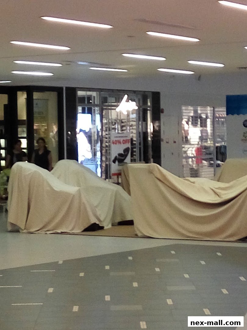 A shop interior with covered displays and a '40% OFF' sign visible.
