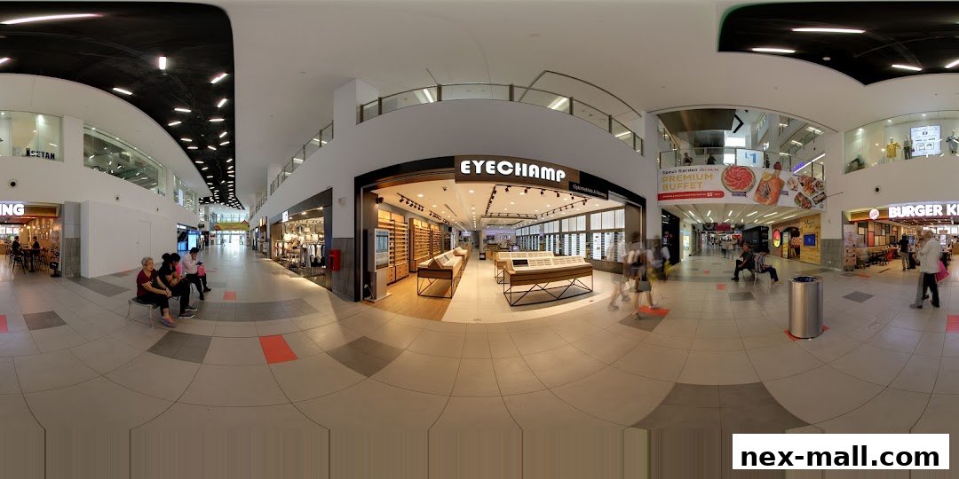 The EyeChamp optical shop entrance with displays of eyeglasses and a modern interior.