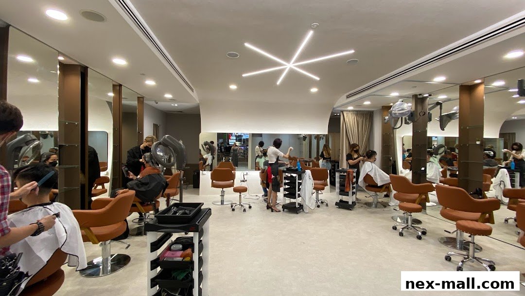 Interior of a modern hair salon with multiple styling stations and clients receiving services.