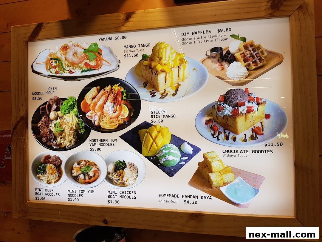 A brightly lit menu board showcasing various Thai-inspired dishes and desserts.