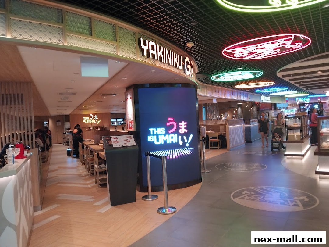 The entrance to Yakiniku-GO NEX restaurant with neon signs and dining area visible.