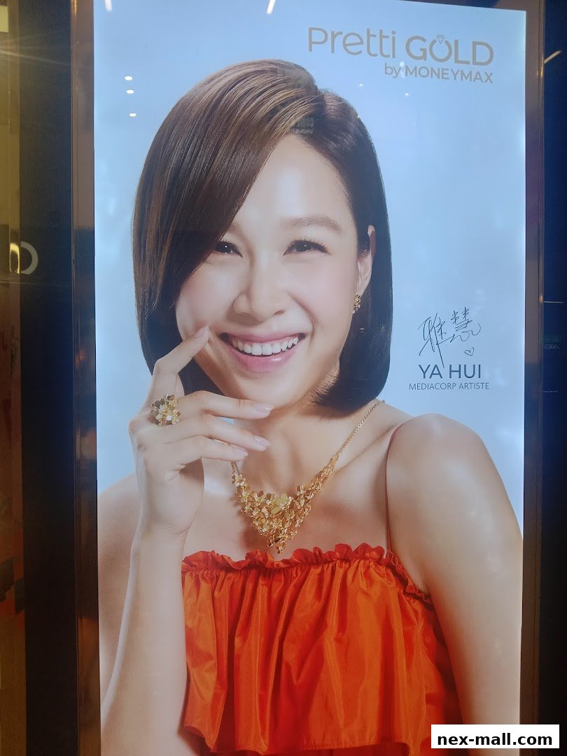 A smiling woman wearing gold jewelry, advertising Pretti Gold by MoneyMax.