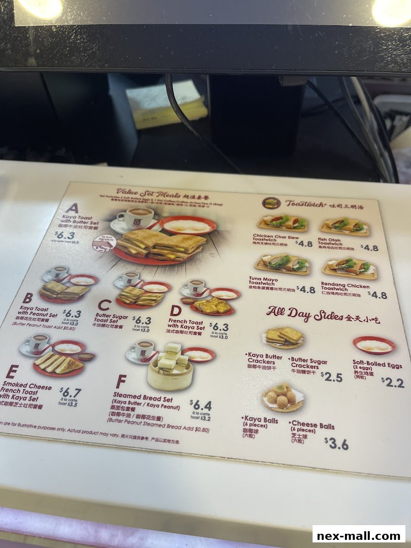 A menu from Ya Kun Kaya Toast featuring various set meals and sides.