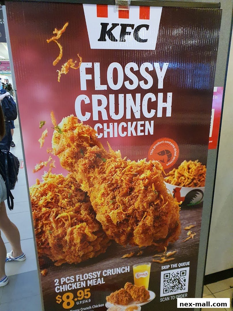 A promotional banner for KFC's Flossy Crunch Chicken meal, featuring crispy chicken pieces.