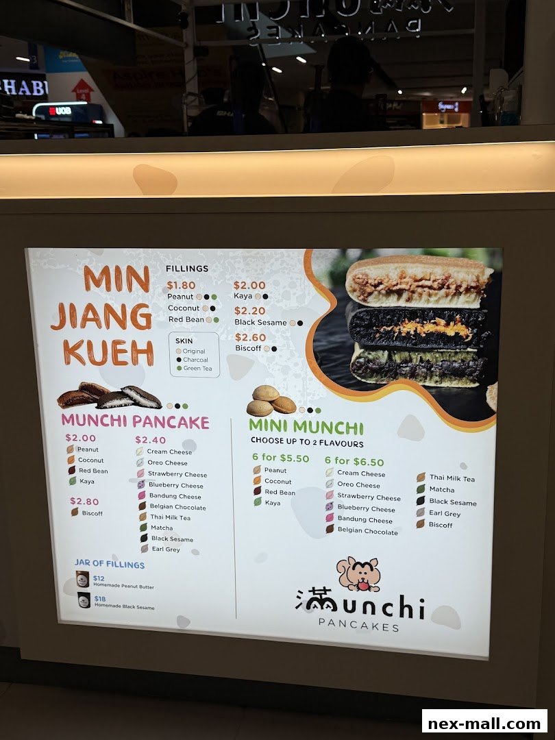 A menu board for Munchi Pancakes, showcasing various pancake flavors and fillings.