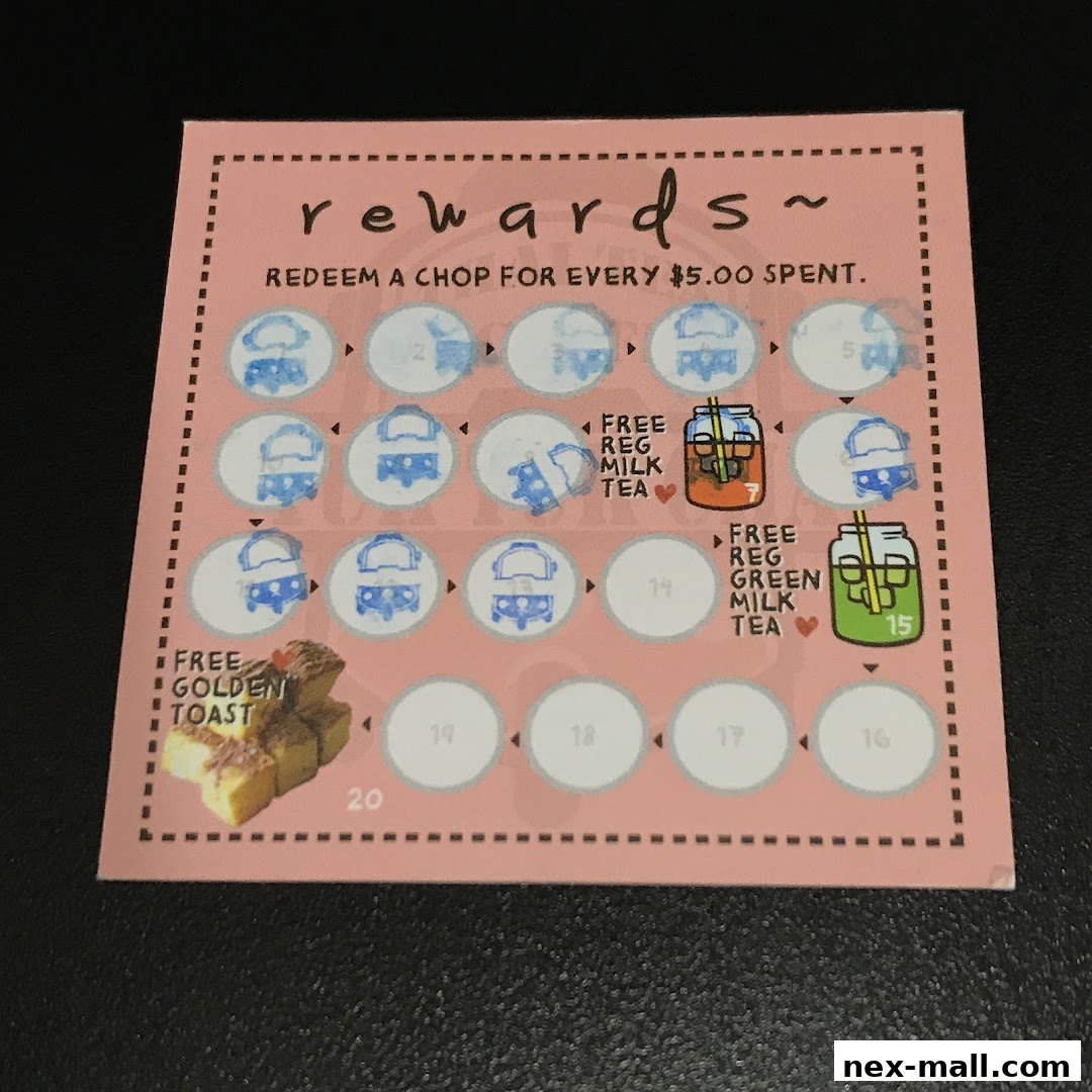 A pink rewards card with stamps and offers for free milk tea and golden toast.