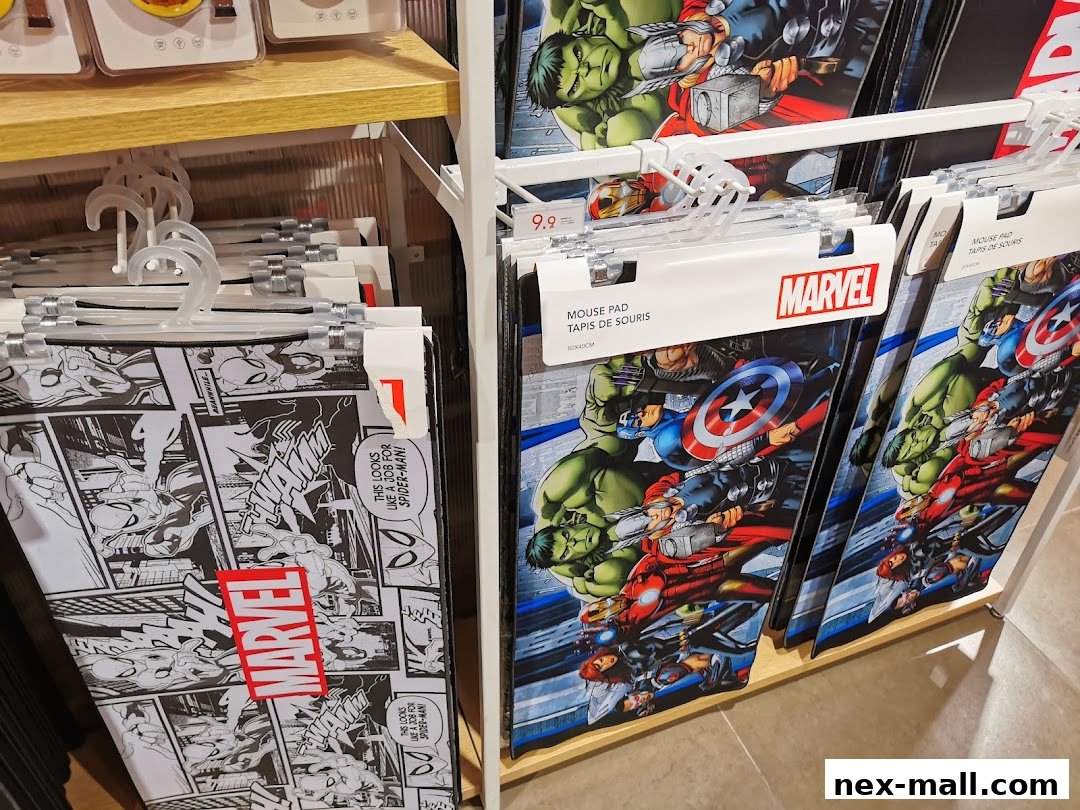 Marvel-themed mouse pads displayed on hangers in a retail store.