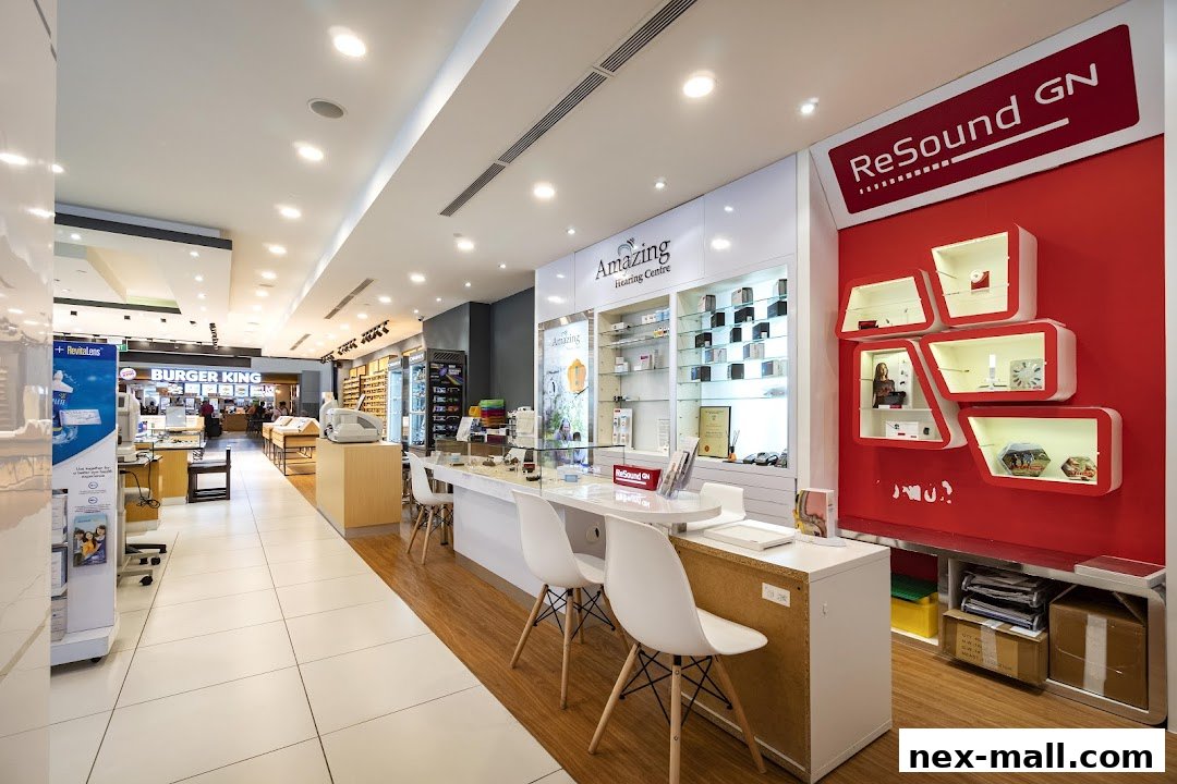 Interior view of an optical and hearing center with product displays and seating.