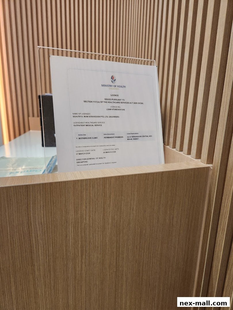 A Ministry of Health license for Motherlove Clinic is displayed on a wooden counter.