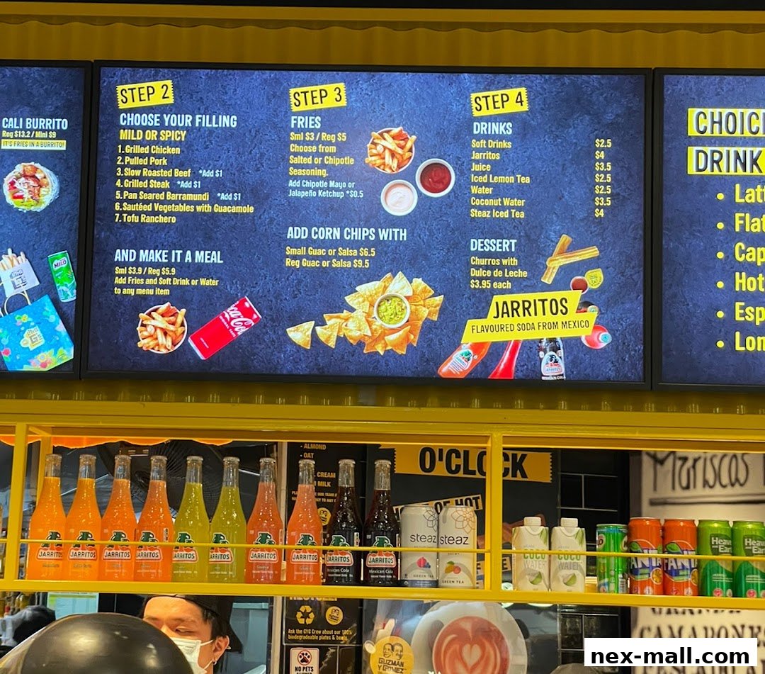 A digital menu board displaying food and drink options with prices and images.
