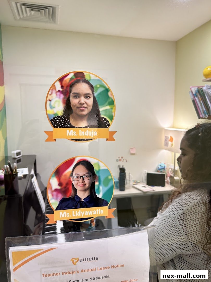 Aureus Academy displays photos of teachers Ms. Induja and Ms. Lidyawatie.