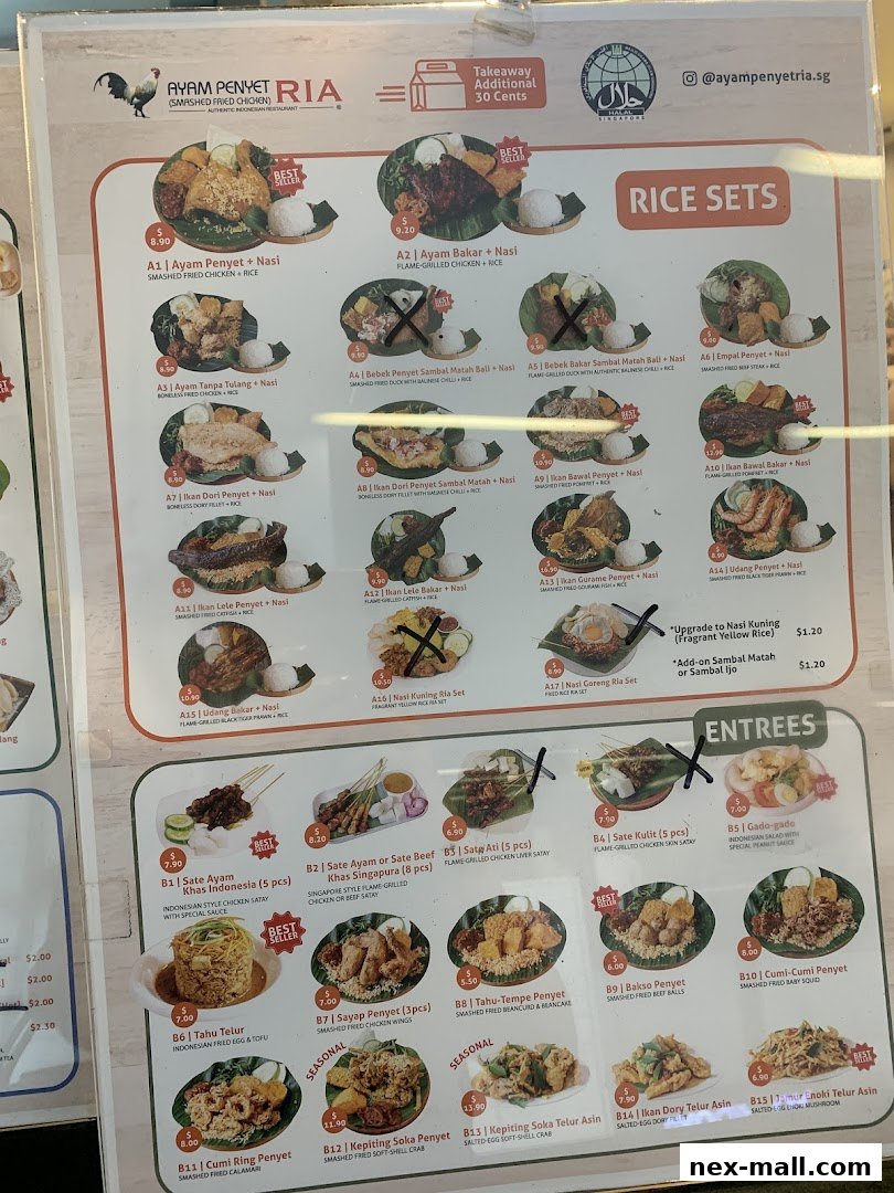 A menu board for Ayam Penyet Ria featuring rice sets and entrees with prices.