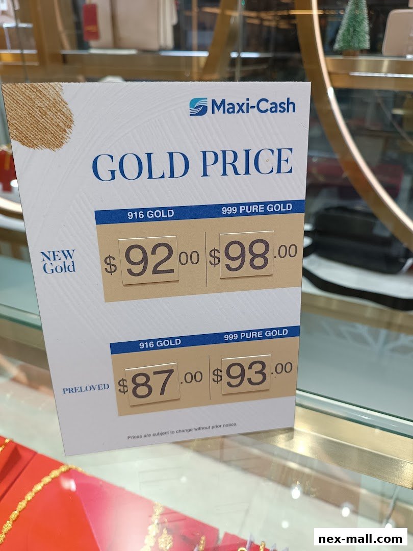 A sign displaying current gold prices for new and preloved gold at Maxi-Cash.