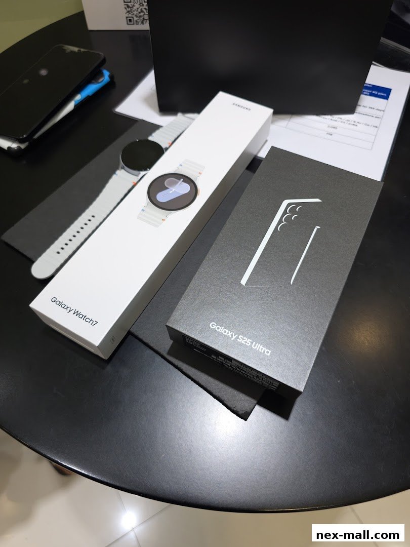 Samsung Galaxy Watch 7 and Galaxy S25 Ultra boxes are displayed on a table.