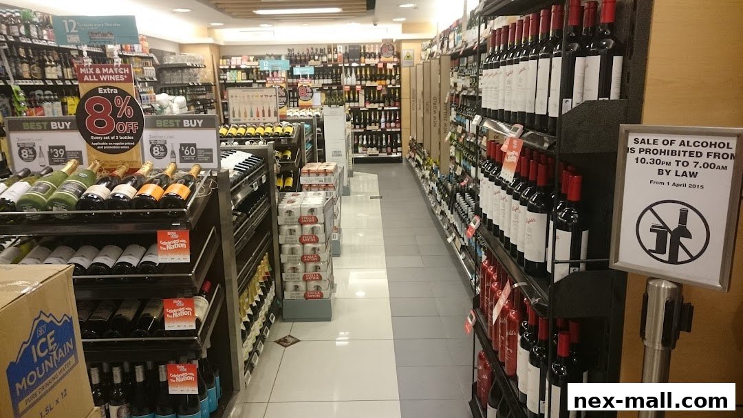 Aisle of a Cold Storage supermarket featuring a wide selection of wines and alcoholic beverages.