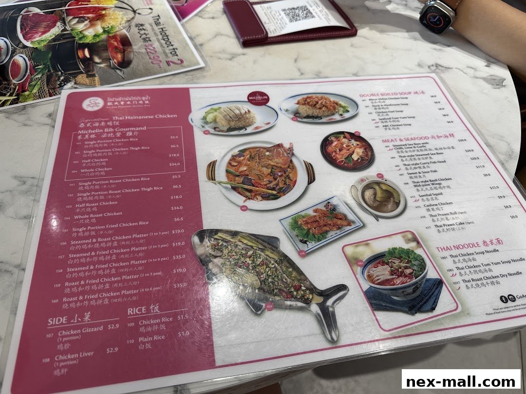 A menu from Go-Ang Pratunam Chicken Rice featuring Hainanese chicken dishes, seafood, noodles, and sides.