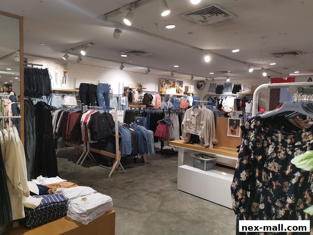 Interior view of a Cotton On store showcasing a wide selection of women's apparel, including jeans, tops, and jackets.