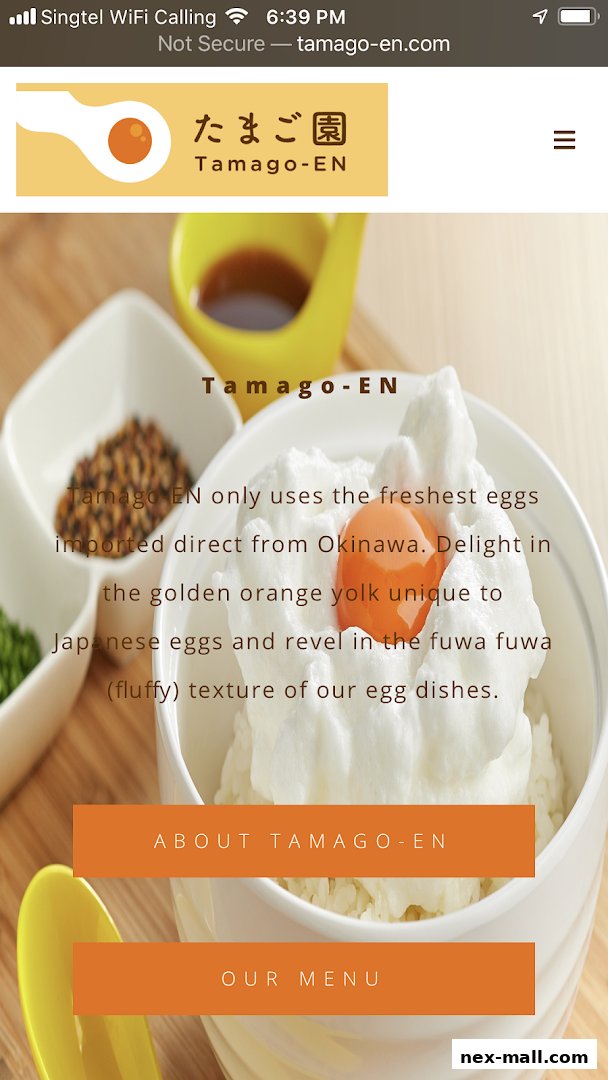 A close-up of a fluffy egg dish with a golden yolk, presented by Tamago-EN.