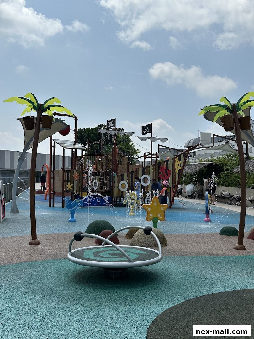 A vibrant pirate-themed water playground with slides, sprinklers, and a merry-go-round.