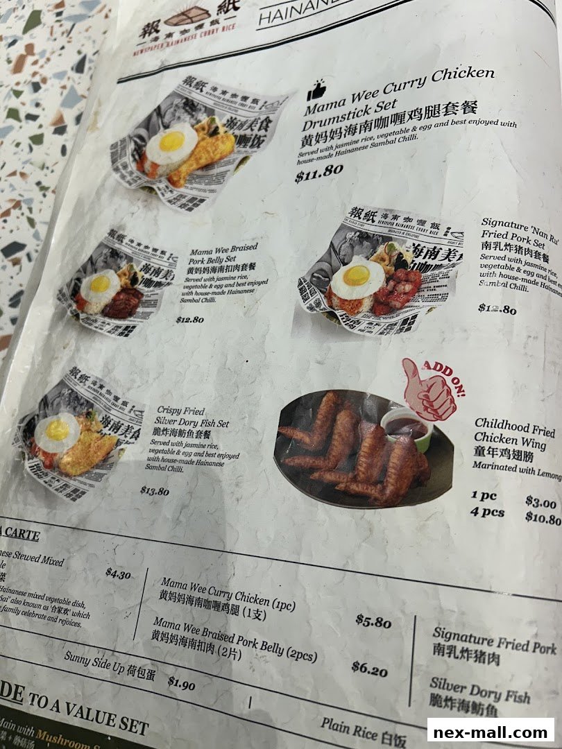 A menu from The Hainan Story Coffee House Nex featuring various chicken and fish dishes.
