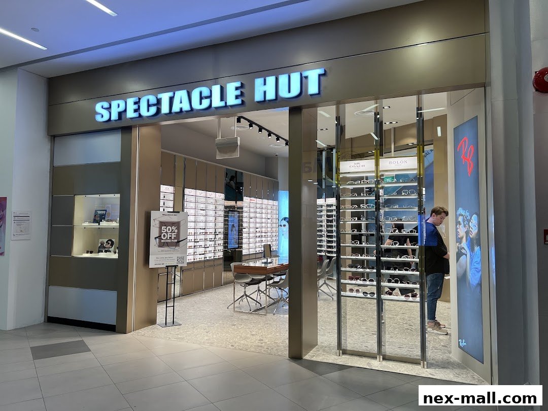Spectacle Hut NEX shop front with a wide selection of eyeglasses and sunglasses on display.
