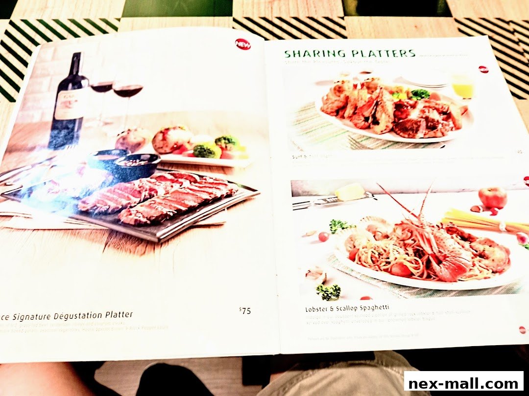 A menu featuring a steak platter, sharing platters, and lobster spaghetti.