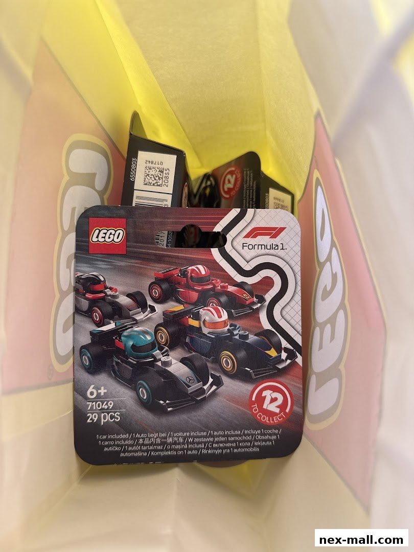 A LEGO Formula 1 car set is displayed inside a yellow shopping bag.