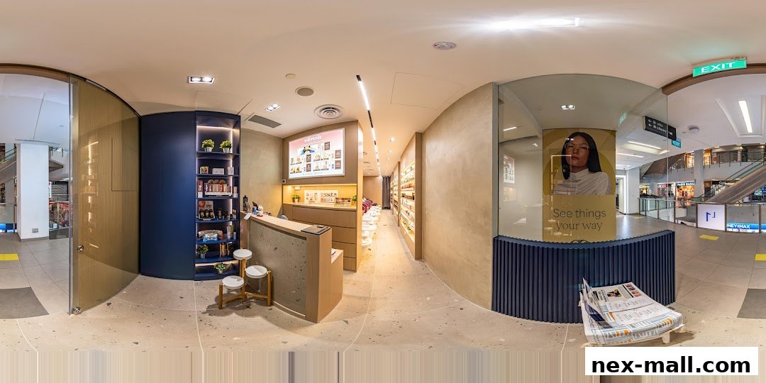 Interior view of Pixie Nail Spa Nex, showcasing a reception area and product displays.
