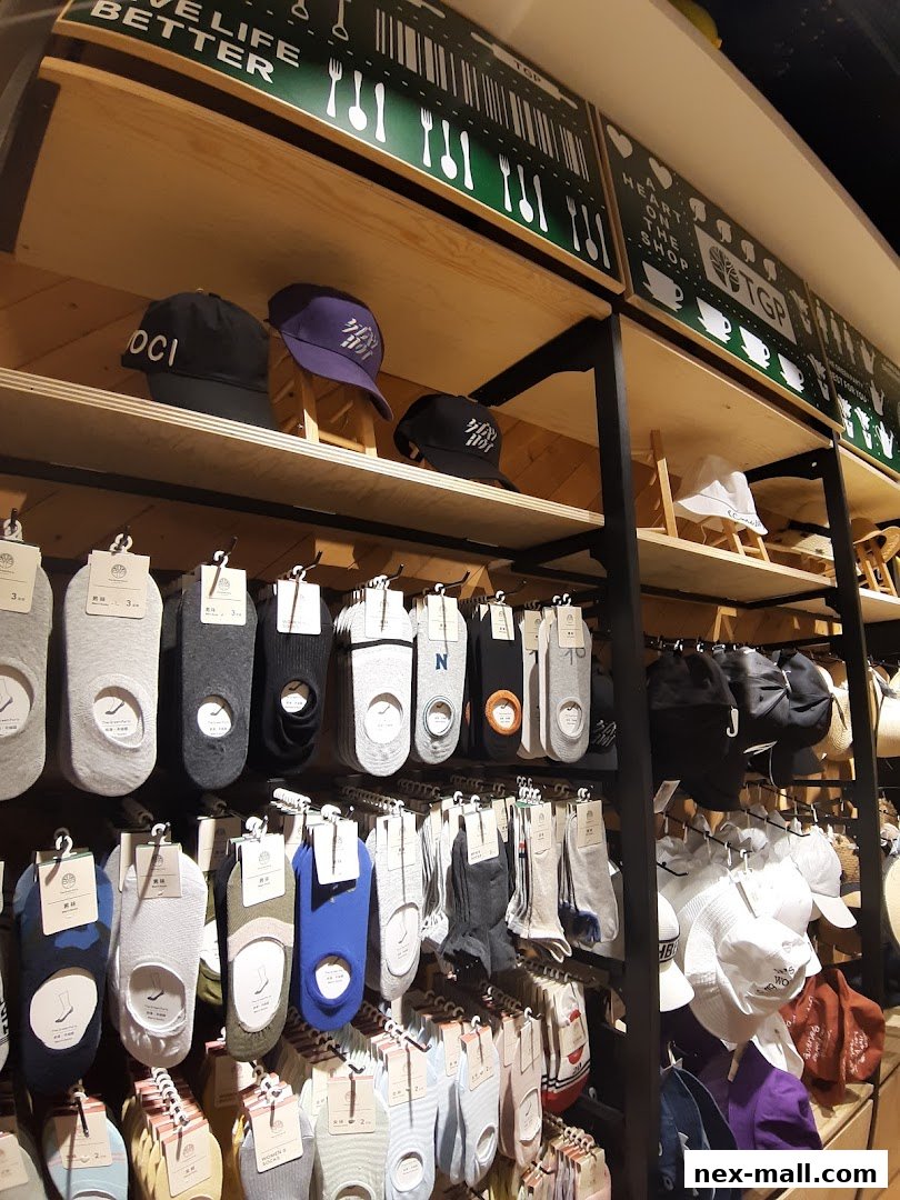 Shelves stocked with various socks and caps, with branding visible.