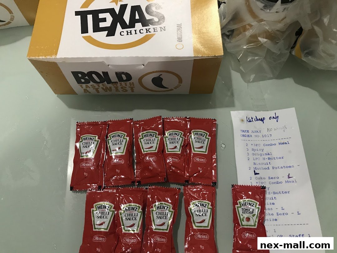 Texas Chicken meal with multiple Heinz chili sauce packets and a receipt.