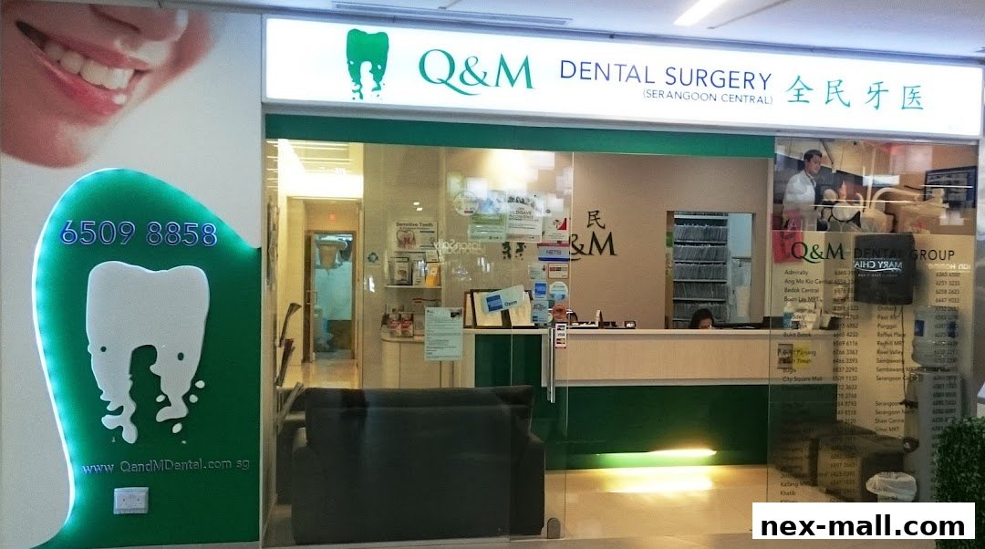The exterior of Q&M Dental Surgery Serangoon, featuring a bright sign and glass entrance.
