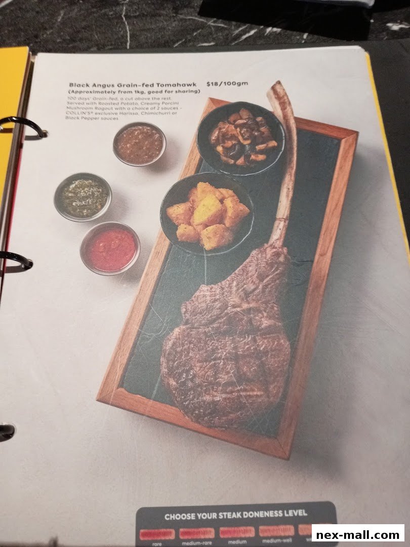 A menu item featuring a Black Angus Grain-fed Tomahawk steak with sides and sauce options.