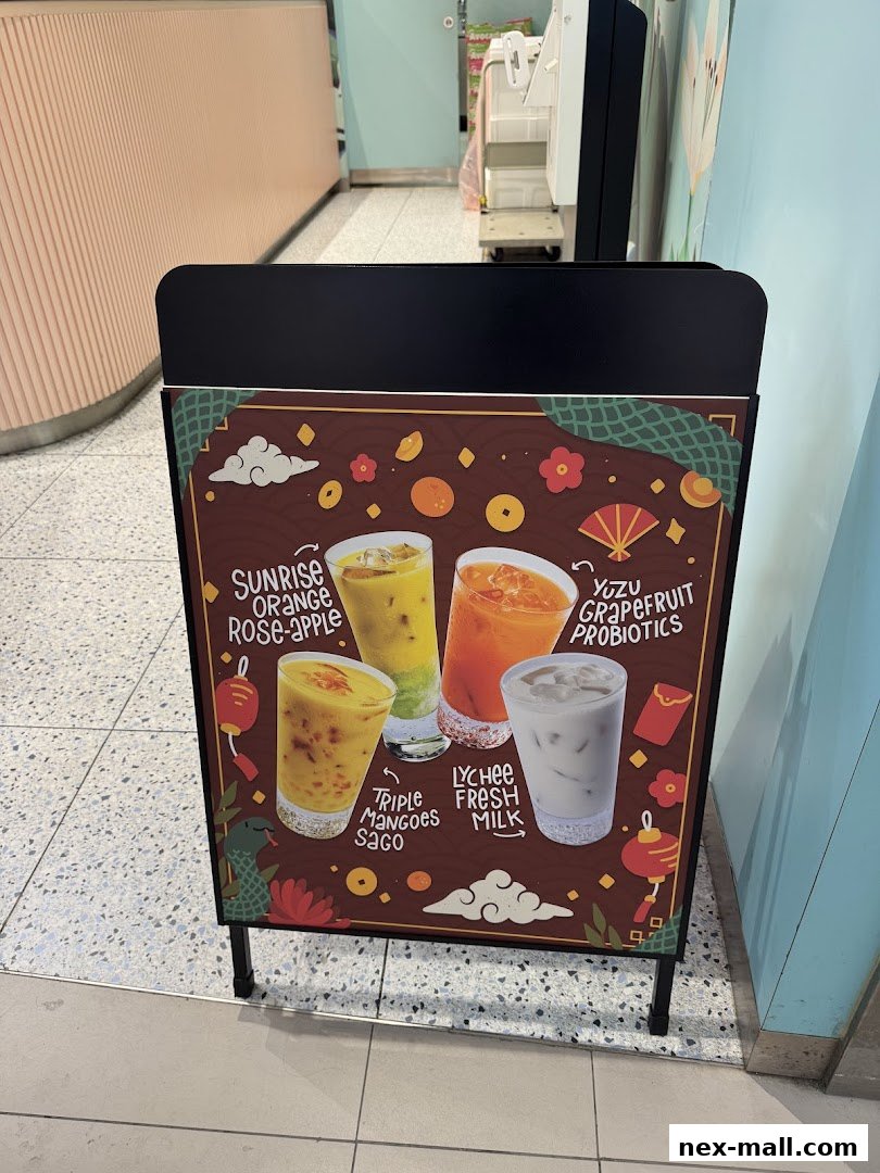 A-frame sign displaying four different beverage options with decorative elements.