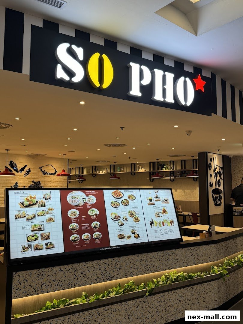 A digital menu board displaying various Vietnamese dishes and drinks at So Pho NEX.